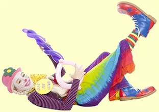 Olive The Clown playing balloon guitar on the ground